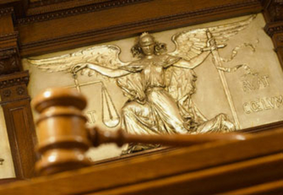 Gavel and Figure of Justice --- Image by © Gaetano/Corbis