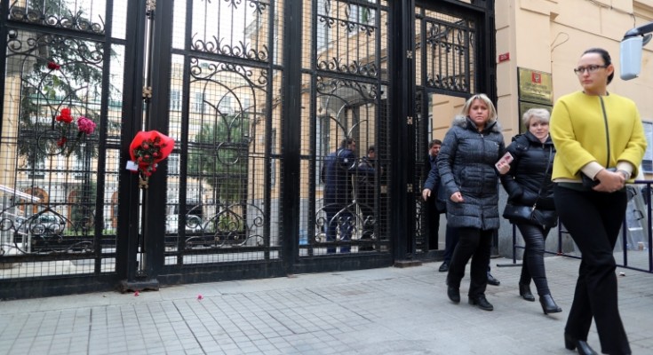 epa05683164 Russian consulate officials leave the consulate amid floral tributes to the murdered Russian ambassador to Turkey Andrey (Andrei) Karlov, in Istanbul, Turkey, 20 December 2016. Andrey Karlov was shot at an art exhibition in the Turkish capital of Ankara on 19 December 2016.  EPA/TOLGA BOZOGLU