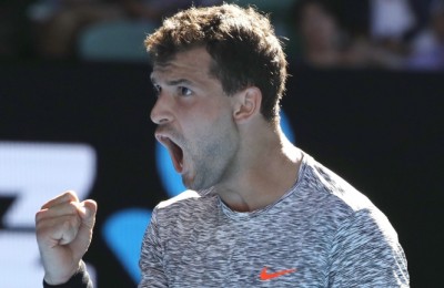 epa05748130 Grigor Dimitrov of Bulgaria reacts with a fist as he wins a game over David Goffin of Belgium during the Men's Singles quarterfinal match at the Australian Open Grand Slam tennis tournament in Melbourne, Victoria, Australia, 25 January 2017.  EPA/MADE NAGI