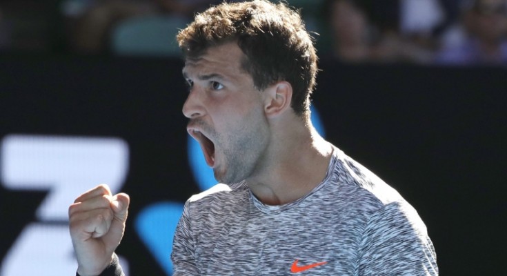epa05748130 Grigor Dimitrov of Bulgaria reacts with a fist as he wins a game over David Goffin of Belgium during the Men's Singles quarterfinal match at the Australian Open Grand Slam tennis tournament in Melbourne, Victoria, Australia, 25 January 2017.  EPA/MADE NAGI