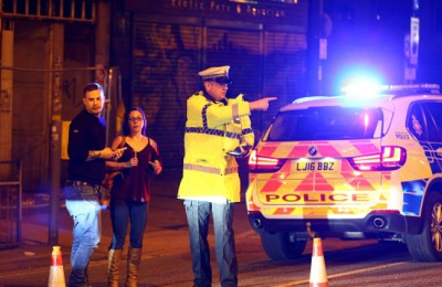 MANCHESTER, ENGLAND - Police stand by a cordoned off street close to the Manchester Arena on May 22, 2017 in Manchester, England.  There have been reports of explosions at Manchester Arena where Ariana Grande had performed this evening.  Greater Manchester Police have have confirmed there are fatalities and warned people to stay away from the area. (Photo by Dave Thompson/Getty Images)