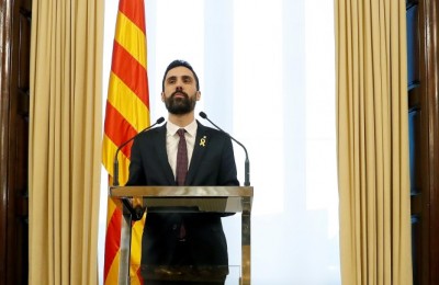 epa06485073 The Speaker of the Catalan Parliament, Roger Torrent, announces that the investiture debate has been postponed, in Barcelona, Spain, 30 January 2018. According to Torrent, 'he will not propose any other candidate but Carles Puigdemont', which is the reason why he has decided to postpone the investiture in order to give time for the Constitutional Court to study Puigdemont's request to be elected President abroad. The Constitutional Court announced on 27 January that Catalonia's fugitive former President Carles Puigdemont must return to Spain if he wants to be elected in the investiture debate, as a preventive turn out to avoid the Catalan Parliament from electing him without being present at the Chamber. The Court also recalled that Puigdemont would need a judicial permission, despite his presence at the Chamber, as there is still a warrant order in force.  EPA/ANDREU DALMAU
