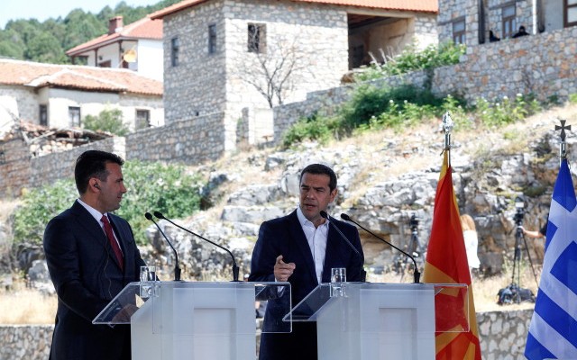 epa06815122 Greek Prime Minister Alexis Tsipras (R) and FYROM Prime Minister Zoran Zaev (L) make statements during a signing ceremony in the village of Psarades, Florina, Greece, 17 June 2018. The foreign ministers of Greece and the Former Yugoslav Republic of Macedonia (FYROM), Nikos Kotzias and Nikola Dimitrov, and the UN Secretary General's Special Envoy for the name dispute signed a historic agreement on 17 June 2018 for resolving the decades-long issue during a lakeside signing ceremony in Prespes, where the borders of Greece, FYROM and Albania meet.  EPA/NIKOS ARVANITIDIS