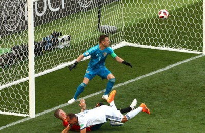 MOSCOW, RUSSIA - JULY 01:  Sergey Ignashevich of Russia scores an own goal to put Spain in front 1-0 during the 2018 FIFA World Cup Russia Round of 16 match between Spain and Russia at Luzhniki Stadium on July 1, 2018 in Moscow, Russia.  (Photo by Oleg Nikishin/Getty Images)