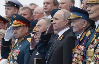 epa07557137 Russian President Vladimir Putin (3-R) and former Kazakh President Nursultan Nazarbayev (C) watch Victory Day parade in Red Square in Moscow, Russia, 09 May 2019. Russia marks 09 May the 74th anniversary of the victory in the World War II over Nazi Germany and its allies. The Soviet Union lost 27 million people in the war.  EPA/YURI KOCHETKOV