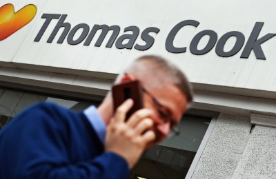 epa07578676 A pedestrian passes a Thomas Cook travel store in London, Britain, 17 May 2019. Reports on 17 May 2019 state Thomas Cook shares plunged some 38 per cent to 12.5 pence, something the Citigroup bank analysts said made them 'worthless'. Thomas Cook on 16 May 2019 issued their third profit warning.  EPA/ANDY RAIN