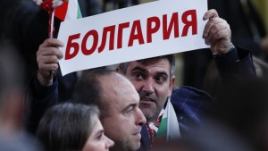 epa08081212 A journalist holds a poster reading 'Bulgaria' prior to the start of Russian President Vladimir Putin's annual news conference with Russian and foreign media at the World Trade Center in Moscow, Russia, 19 December 2019. A total of 1,895 journalists were accredited for Putin's annual news conference.  EPA/YURI KOCHETKOV