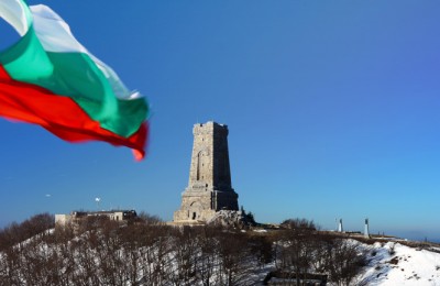 Memorial Shipka view in Bulgaria.Bulgarian flag in front.