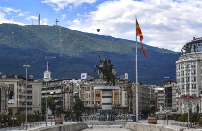 epa08441125 A bird flies over the empty main square during curfew in downtown Skopje, North Macedonia, 24 May 2020. Due to the increased number of newly-registered cases of the pandemic COVID-19 disease caused by the SARS-CoV-2 coronavirus, as well as the celebration of the Muslim holiday of Eid al-Fitr, the Macedonian government has decided to impose a curfew from 11 am on 24 May until 5 am on 26 May.  EPA/GEORGI LICOVSKI