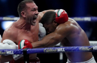 LONDON, ENGLAND - DECEMBER 12: Kubrat Pulev reacts while holding onto Anthony Joshua during the IBF, WBA, WBO and IBO World Heayweight Title fight between Anthony Joshua and Kubrat Pulev at The SSE Arena, Wembley on December 12, 2020 in London, England. A limited number of fans (1000) are welcomed back to sporting venues to watch elite sport across England. This was following easing of restrictions on spectators in tiers one and two areas only. (Photo by Andrew Couldridge - Pool/Getty Images)