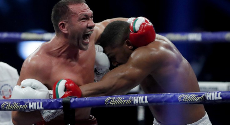 LONDON, ENGLAND - DECEMBER 12: Kubrat Pulev reacts while holding onto Anthony Joshua during the IBF, WBA, WBO and IBO World Heayweight Title fight between Anthony Joshua and Kubrat Pulev at The SSE Arena, Wembley on December 12, 2020 in London, England. A limited number of fans (1000) are welcomed back to sporting venues to watch elite sport across England. This was following easing of restrictions on spectators in tiers one and two areas only. (Photo by Andrew Couldridge - Pool/Getty Images)