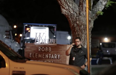 epa09973533 Police and investigators continue to work at the scene of a mass shooting at the Robb Elementary School in Uvalde, Texas, USA, 24 May 2022. According to Texas Governor Greg Abbott, at least 18 children and two adults were killed in the shooting. The eighteen-year-old gunman was killed by responding officers.  EPA/AARON M. SPRECHER