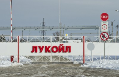 Volgograd, Russia - February 7, 2014: Automatic gates at the checkpoint with the inscription LUKOIL. Entry to the territory of the Volgograd oil depots through a checkpoint