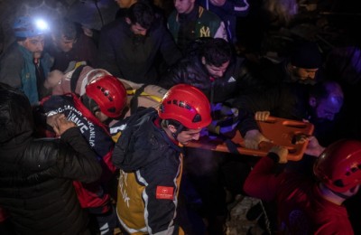 epa10450305 Turkish emergency personnel help a victim at the site of a collapsed building after an earthquake in Diyarbakir, Turkey, 06 February 2023. According to the US Geological Service, an earthquake with a preliminary magnitude of 7.8 struck southeast Turkey close to the Syrian border. The earthquake caused buildings to collapse and sent shockwaves over northwest Syria, Cyprus, and Lebanon.  EPA/REFIK TEKIN