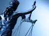 Statue of justice on blue background