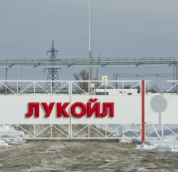 Volgograd, Russia - February 7, 2014: Automatic gates at the checkpoint with the inscription LUKOIL. Entry to the territory of the Volgograd oil depots through a checkpoint