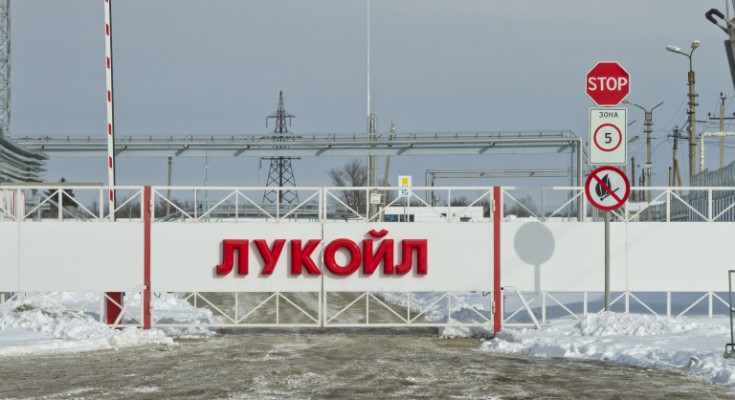 Volgograd, Russia - February 7, 2014: Automatic gates at the checkpoint with the inscription LUKOIL. Entry to the territory of the Volgograd oil depots through a checkpoint