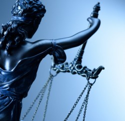 Statue of justice on blue background