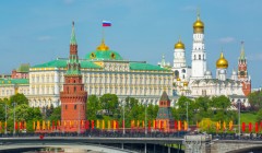 View of Moscow Kremlin behind the Bolshoy Kamenny Bridge with bright flags