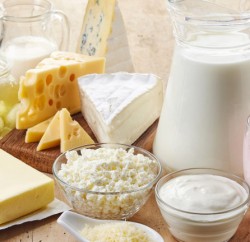 Various fresh dairy products on wooden background