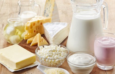 Various fresh dairy products on wooden background