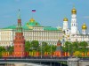 View of Moscow Kremlin behind the Bolshoy Kamenny Bridge with bright flags