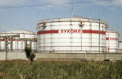 Volgograd, Russia - August 28, 2015:  Huge storage tanks for petroleum products with the logo of LUKOIL on the background of a large refinery